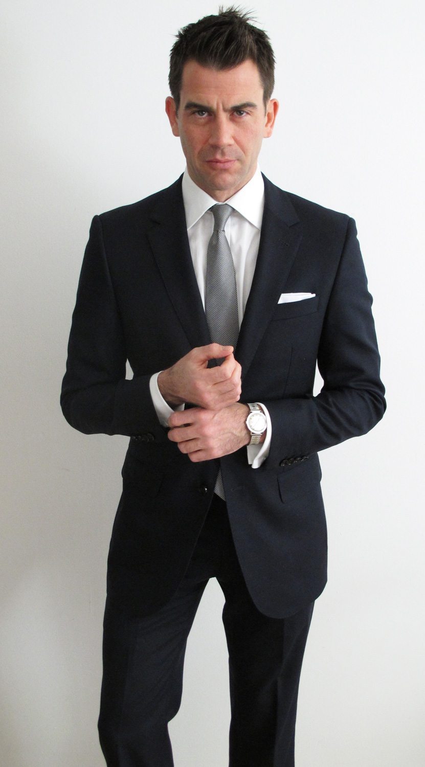 black suit with navy shirt